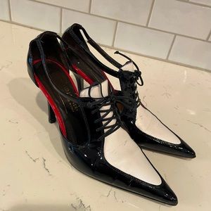 Donald Pliner, black and white spectator heal. 6 1/2